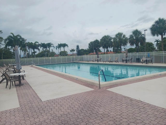 8205 Winnipesaukee Way, Lake Worth, FL 33467 - community pool featuring a patio area