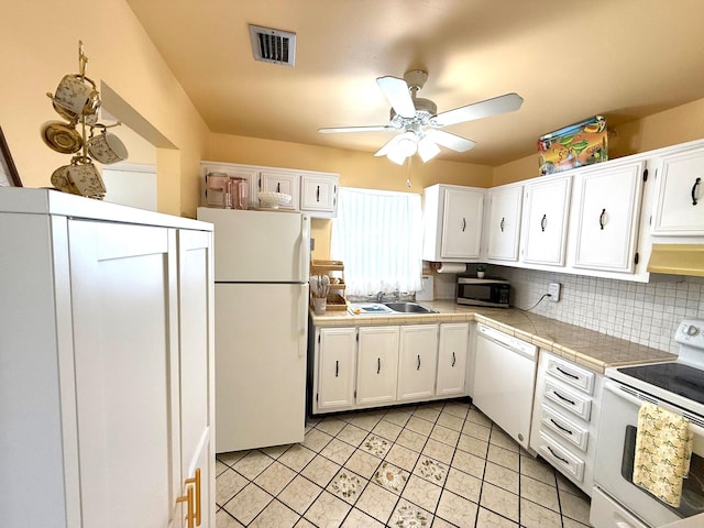 709 Lori Dr Unit 301, Palm Springs, FL 33461 - kitchen featuring white appliances, a sink, white cabinets, a ceiling fan, and under cabinet range hood