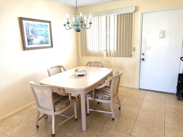 709 Lori Dr Unit 301, Palm Springs, FL 33461 - dining room with a chandelier, light tile patterned flooring, and baseboards