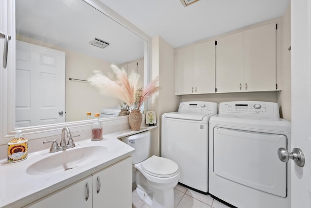 506 5th Ter, Palm Beach Gardens, FL 33418 - bathroom with washer and dryer, toilet, vanity, and tile patterned floors