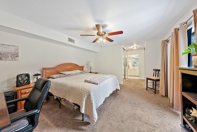 506 5th Ter, Palm Beach Gardens, FL 33418 - bedroom featuring light carpet, ensuite bath, and a ceiling fan