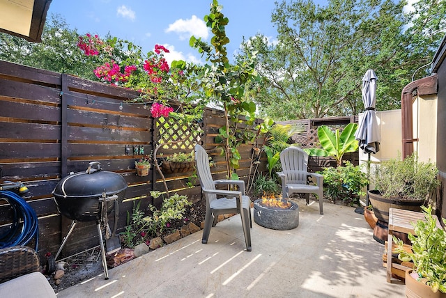 506 5th Ter, Palm Beach Gardens, FL 33418 - fenced backyard featuring an outdoor fire pit, a patio area, and grilling area