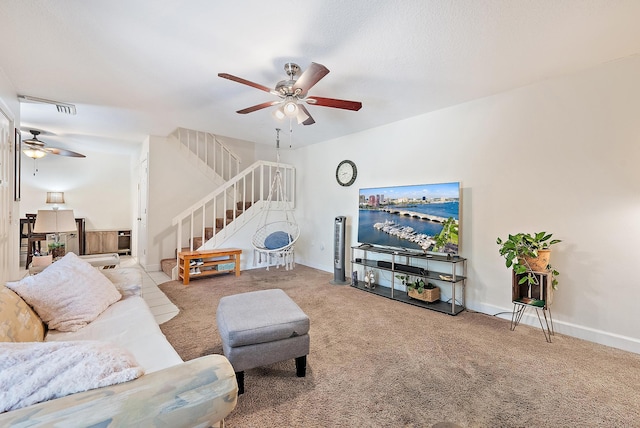 506 5th Ter, Palm Beach Gardens, FL 33418 - carpeted living room featuring ceiling fan, stairway, and baseboards