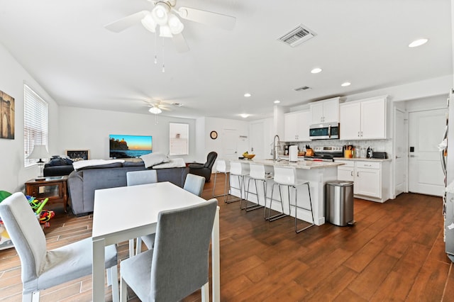 6143 Wildfire Way, West Palm Beach, FL 33415 - dining area featuring ceiling fan, dark wood-type flooring, and recessed lighting