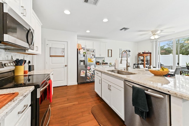 6143 Wildfire Way, West Palm Beach, FL 33415 - kitchen featuring stainless steel appliances, a sink, a ceiling fan, dark wood-type flooring, and recessed lighting