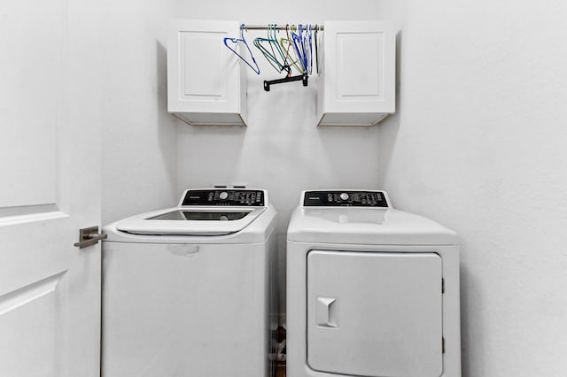 6143 Wildfire Way, West Palm Beach, FL 33415 - washroom with cabinet space and separate washer and dryer