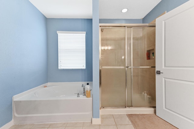 6143 Wildfire Way, West Palm Beach, FL 33415 - full bath with tile patterned floors, a stall shower, a garden tub, and baseboards