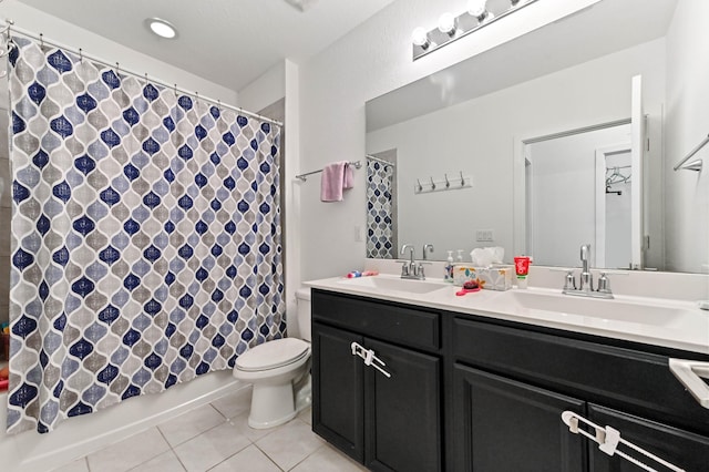 6143 Wildfire Way, West Palm Beach, FL 33415 - full bath with tile patterned floors, double vanity, toilet, and shower / tub combo with curtain