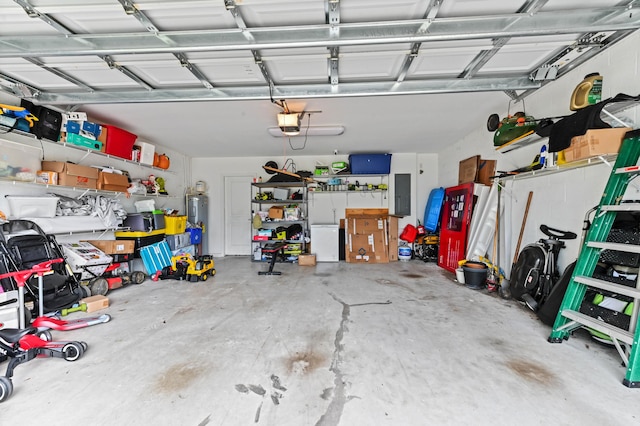 6143 Wildfire Way, West Palm Beach, FL 33415 - garage featuring a garage door opener, electric panel, and water heater