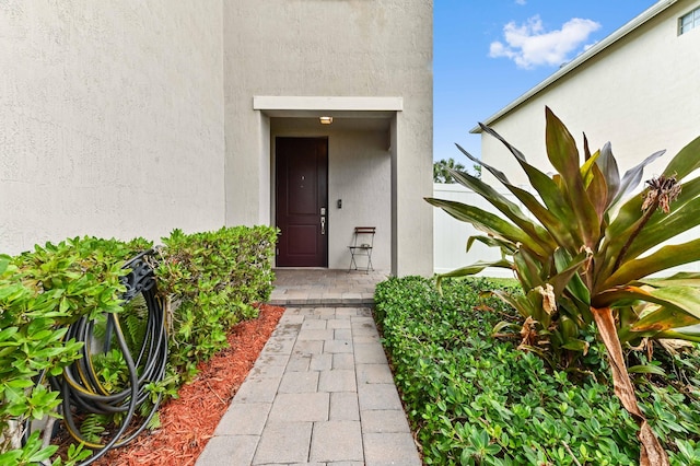 6143 Wildfire Way, West Palm Beach, FL 33415 - entrance to property featuring stucco siding