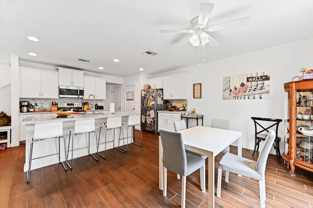 6143 Wildfire Way, West Palm Beach, FL 33415 - dining room featuring dark wood-style floors, recessed lighting, and a ceiling fan
