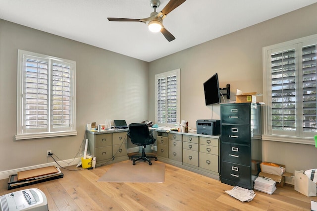 101 Saint Pierre Way, Jupiter, FL 33458 - home office with wood finished floors, a ceiling fan, and baseboards