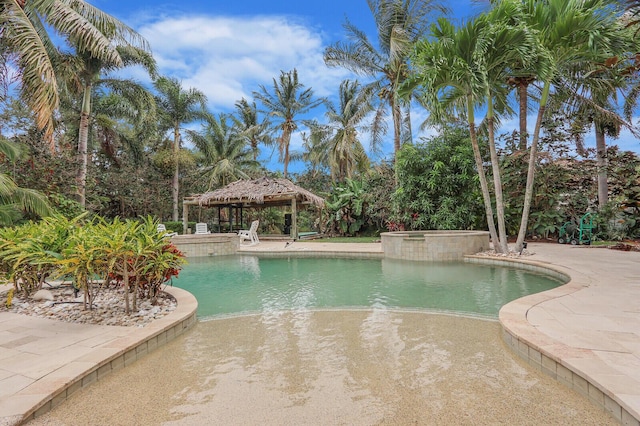 101 Saint Pierre Way, Jupiter, FL 33458 - view of swimming pool featuring a gazebo and a pool with connected hot tub