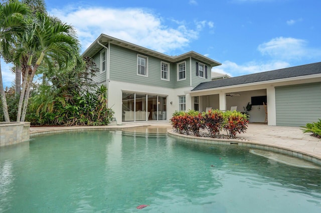 101 Saint Pierre Way, Jupiter, FL 33458 - back of property featuring an outdoor pool, a patio area, and ceiling fan