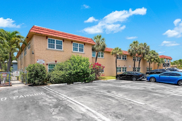 221 SE 9th Ave Unit 202, Pompano Beach, FL 33060 - view of building exterior with uncovered parking