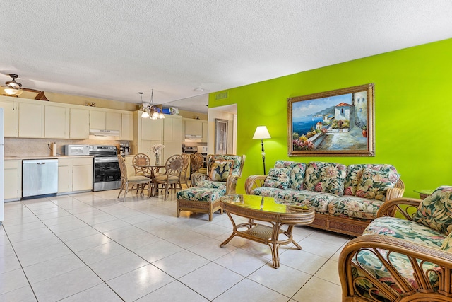 221 SE 9th Ave Unit 202, Pompano Beach, FL 33060 - living area with a textured ceiling, light tile patterned floors, a chandelier, and ceiling fan