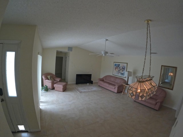 1713 Mariners Cv Unit 7C, Fort Pierce, FL 34950 - living room with lofted ceiling, a ceiling fan, and baseboards