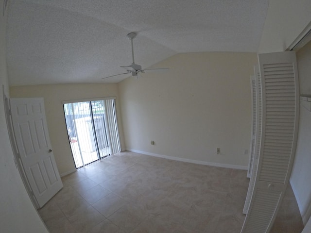 1713 Mariners Cv Unit 7C, Fort Pierce, FL 34950 - empty room featuring vaulted ceiling, ceiling fan, and baseboards