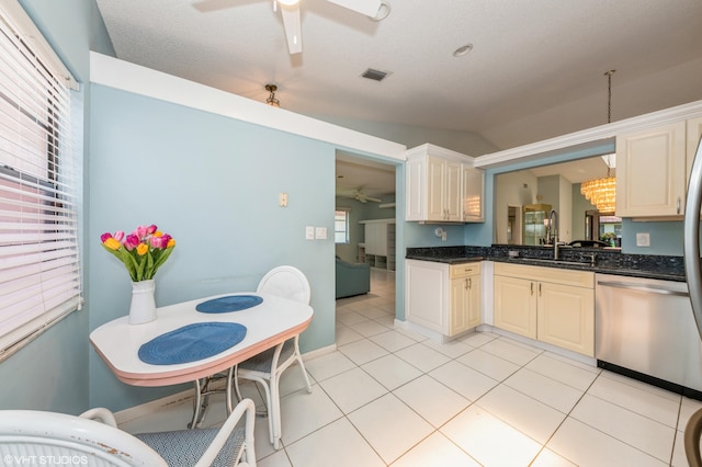 6491 Royal Manor Cir, Delray Beach, FL 33484 - kitchen with stainless steel dishwasher, ceiling fan, a sink, and light tile patterned floors
