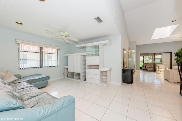 6491 Royal Manor Cir, Delray Beach, FL 33484 - living area with tile patterned floors, a skylight, plenty of natural light, baseboards, and recessed lighting