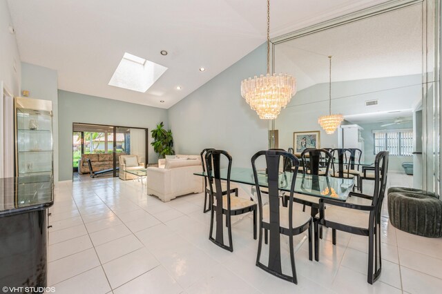 6491 Royal Manor Cir, Delray Beach, FL 33484 - dining room featuring vaulted ceiling, plenty of natural light, a skylight, a chandelier, and light tile patterned floors