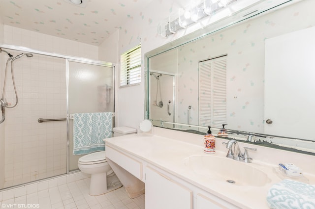 6491 Royal Manor Cir, Delray Beach, FL 33484 - bathroom featuring toilet, a stall shower, tile patterned flooring, and vanity