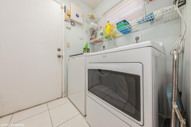 6491 Royal Manor Cir, Delray Beach, FL 33484 - laundry room with washing machine and dryer and tile patterned floors