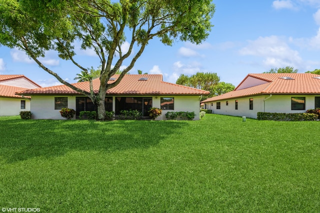 6491 Royal Manor Cir, Delray Beach, FL 33484 - rear view of property featuring stucco siding, a yard, and a tile roof