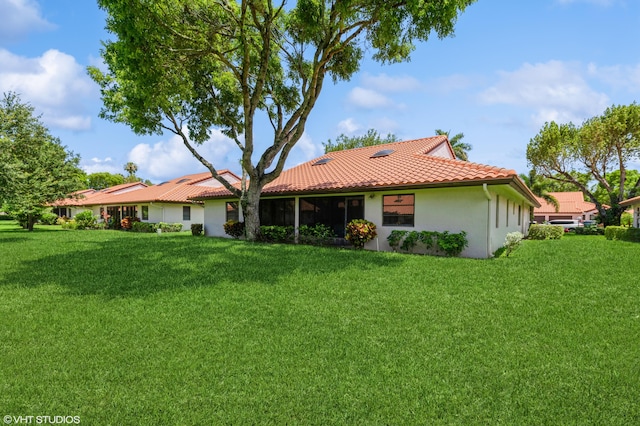 6491 Royal Manor Cir, Delray Beach, FL 33484 - rear view of property featuring a tile roof, a yard, and stucco siding