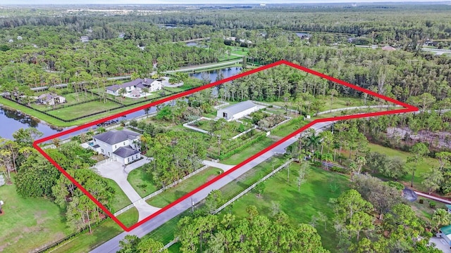 6688 Duckweed Rd, Lake Worth, FL 33449 - view of property location featuring a forest, property parcel outlined, and a nearby body of water