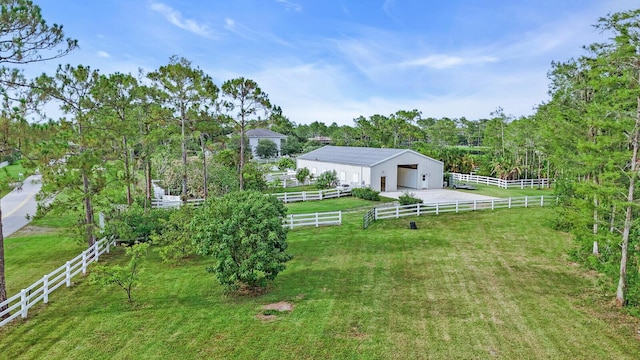 6688 Duckweed Rd, Lake Worth, FL 33449 - view of green lawn featuring an outdoor structure, a detached garage, and an exterior structure