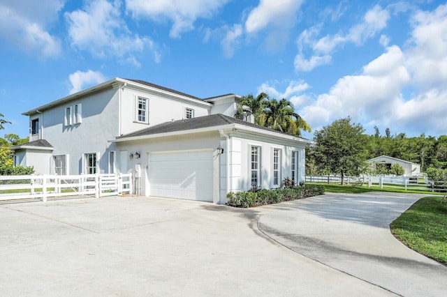 6688 Duckweed Rd, Lake Worth, FL 33449 - view of home's exterior with concrete driveway and stucco siding