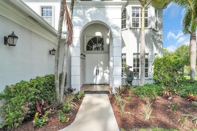 6688 Duckweed Rd, Lake Worth, FL 33449 - doorway to property featuring stucco siding