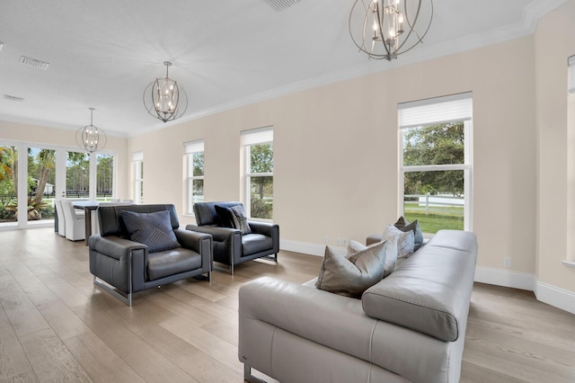 6688 Duckweed Rd, Lake Worth, FL 33449 - living area featuring a chandelier, light wood-type flooring, crown molding, and baseboards