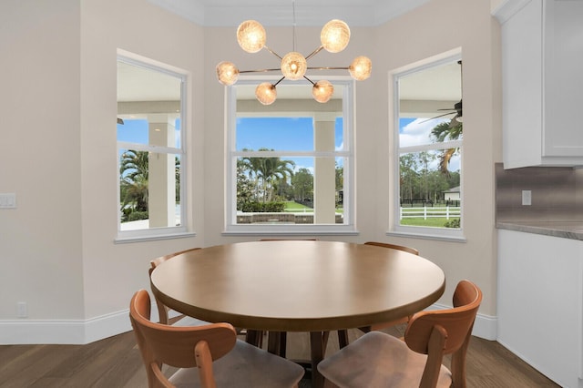 6688 Duckweed Rd, Lake Worth, FL 33449 - dining space with healthy amount of natural light, dark wood finished floors, and baseboards
