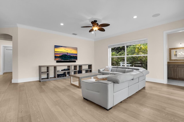 6688 Duckweed Rd, Lake Worth, FL 33449 - living room with light wood-style flooring, a ceiling fan, arched walkways, baseboards, and ornamental molding