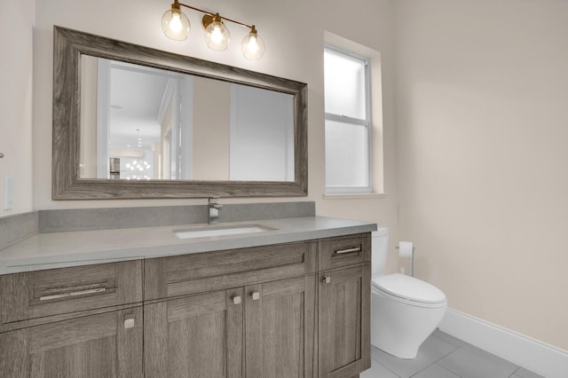 6688 Duckweed Rd, Lake Worth, FL 33449 - bathroom with vanity, toilet, tile patterned floors, and baseboards