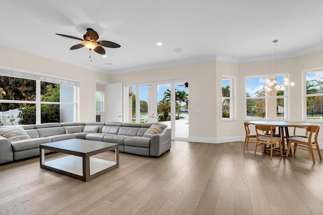 6688 Duckweed Rd, Lake Worth, FL 33449 - living area featuring plenty of natural light, light wood-style flooring, crown molding, baseboards, and ceiling fan