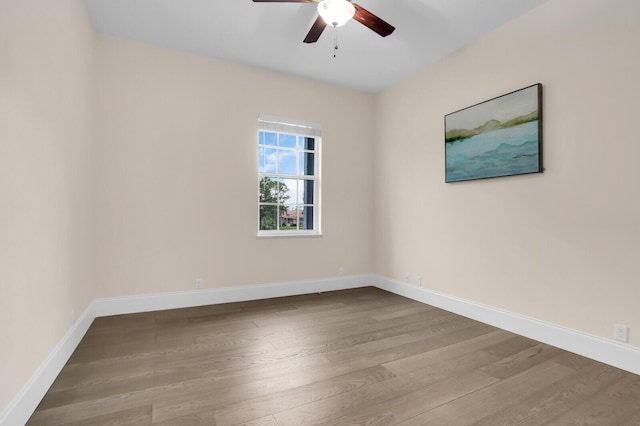 6688 Duckweed Rd, Lake Worth, FL 33449 - unfurnished room featuring wood finished floors, a ceiling fan, and baseboards