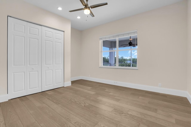 6688 Duckweed Rd, Lake Worth, FL 33449 - unfurnished bedroom with light wood-style flooring, baseboards, recessed lighting, a closet, and ceiling fan