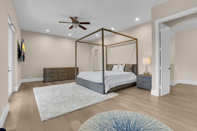 6688 Duckweed Rd, Lake Worth, FL 33449 - bedroom featuring wood finished floors, baseboards, recessed lighting, arched walkways, and ceiling fan