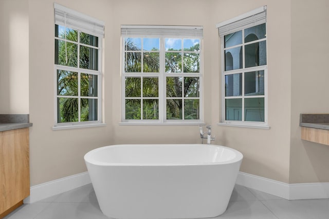 6688 Duckweed Rd, Lake Worth, FL 33449 - full bath with baseboards, a soaking tub, and tile patterned floors
