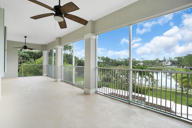 6688 Duckweed Rd, Lake Worth, FL 33449 - unfurnished sunroom featuring a water view