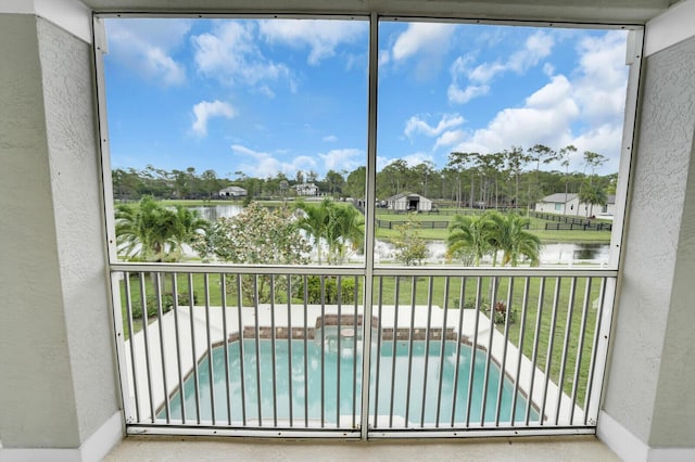 6688 Duckweed Rd, Lake Worth, FL 33449 - unfurnished sunroom featuring a water view and view of scattered trees