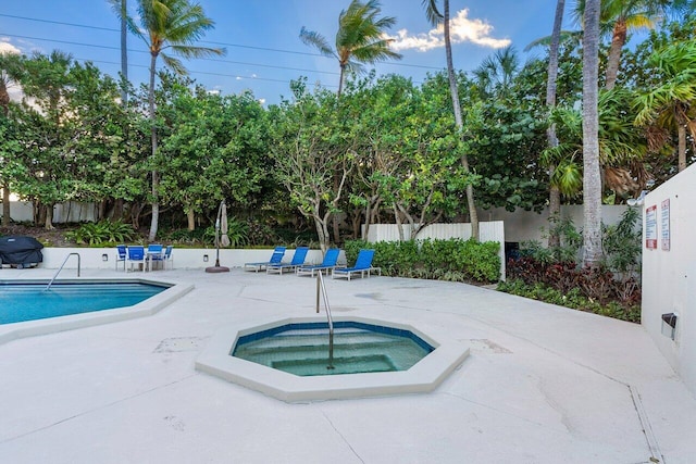 2401 N Ocean Blvd Unit 2N, Boca Raton, FL 33431 - community pool featuring a community hot tub, a patio, and area for grilling