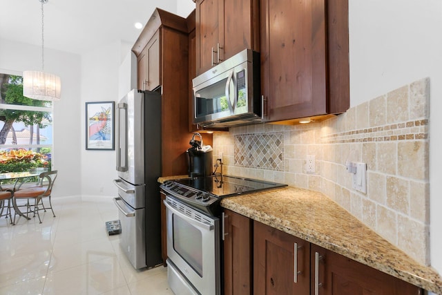 6607 NW 25th Way, Boca Raton, FL 33496 - kitchen with appliances with stainless steel finishes, baseboards, a chandelier, decorative backsplash, and light stone counters