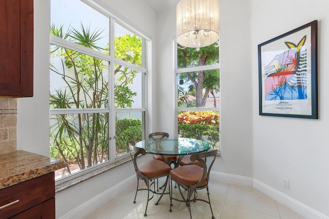 6607 NW 25th Way, Boca Raton, FL 33496 - dining space with healthy amount of natural light, a chandelier, and baseboards