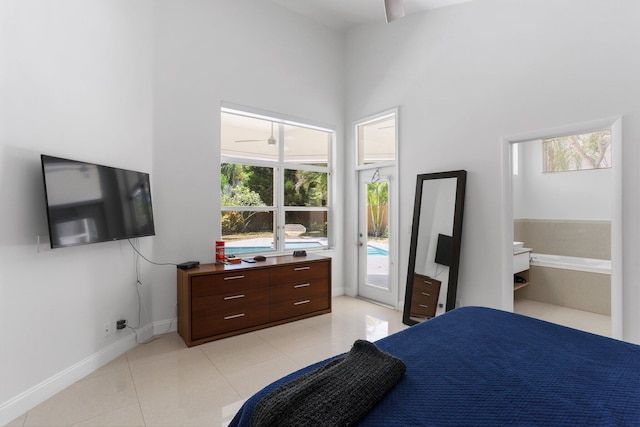 6607 NW 25th Way, Boca Raton, FL 33496 - bedroom featuring access to exterior, light tile patterned flooring, baseboards, and a high ceiling