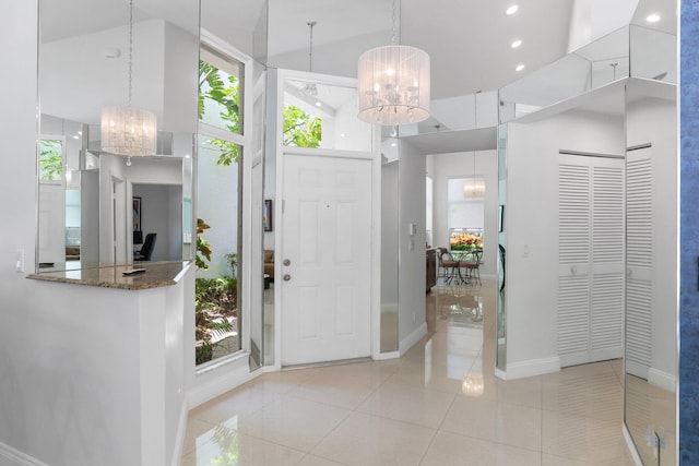 6607 NW 25th Way, Boca Raton, FL 33496 - entrance foyer with a chandelier, a towering ceiling, baseboards, recessed lighting, and light tile patterned floors