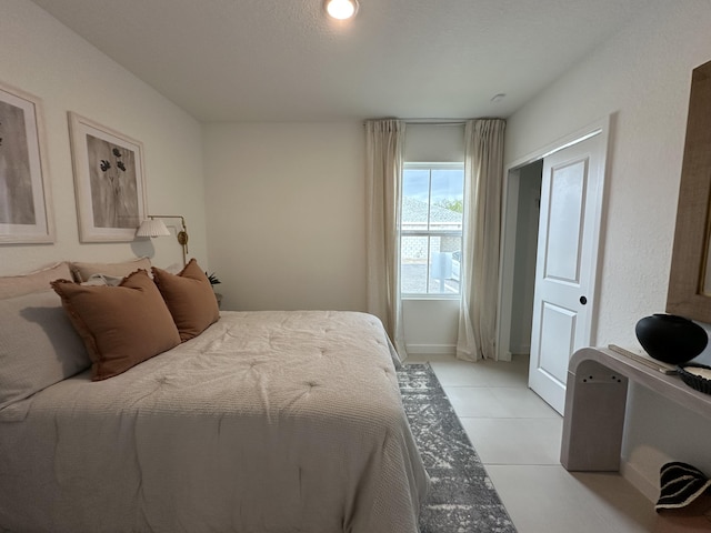 306 Silver Sands Ln Unit 17, Fort Pierce, FL 34945 - bedroom featuring light tile patterned floors